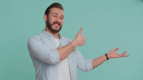 Lebanese Man Showing Thumbs Up Pointing Empty Place Advertising Area for Commercial Text Copy Space