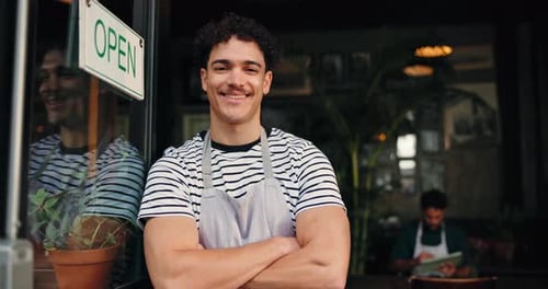 Waiter, face and arms crossed at door of restaurant for welcome, customer service and hospitality