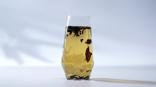 Refreshing Steaming Glass Cup Of Tranquil Green Elegant tea ceremony: Aromatic Herbal Infusion