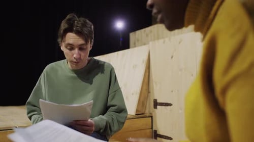 Actor Practicing Dialogue with Female Partner during Theatre Rehearsal