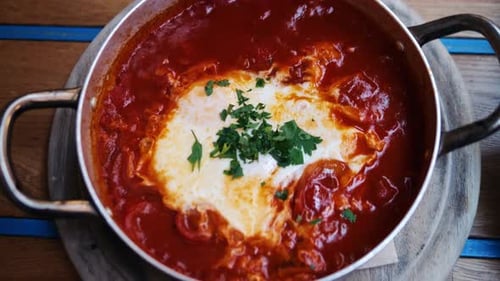 Shakshuka in Iron Frying Pan in Israel Cafe