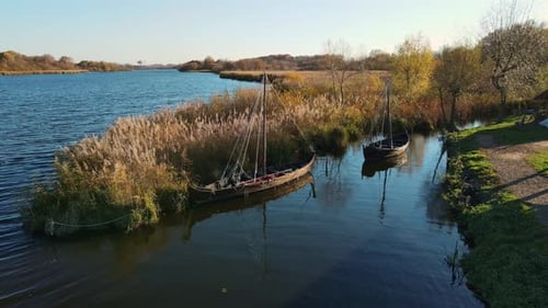 Aerial Shot By the Lake with Ancient Boats