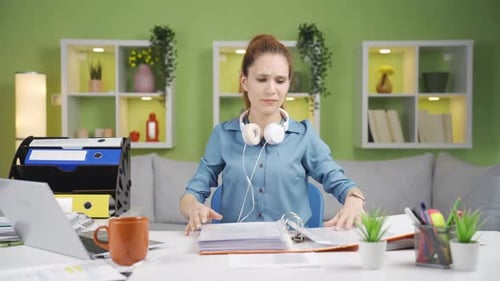 Frustrated Woman Working at Home Office Desk