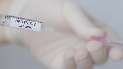 Hand Pull Out The Needle From Syringe With Sputnik-V Vaccine (Russia's Corona Virus Vaccine), Close