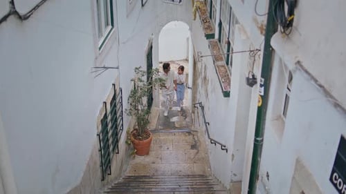 Relaxed Newlyweds Strolling Stairs Old Town Sweet Girl Guy Walking Tiny Street