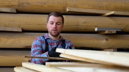 Builder Folds Wooden Planks Concept Sale of Lumber Builder is Considering Wood Planks Concept Wood