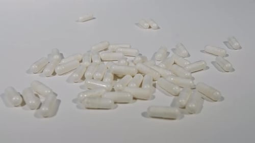 White Pills on White Background