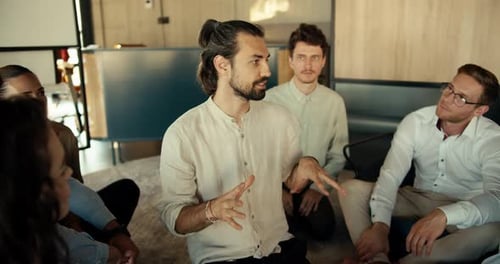 A Man in a Shirt Talks About His Problem at a Group Therapy in the Office The Rest of the