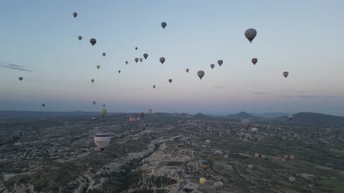 Aerial video over monoliths in Cappadocia, on hot air balloons, Turkey
