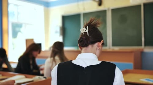 Teen Student in Classroom with Other Students