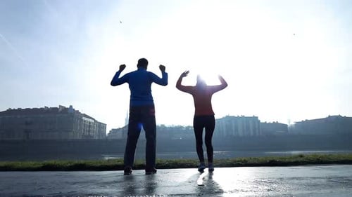 Successful Joggers Jumping Near River in City, Super 240