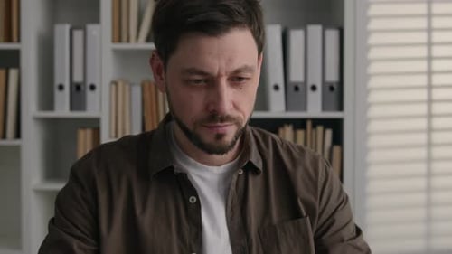 Pensive Thoughtful Caucasian Man Work with Laptop in Office Male Writer Journalist Web Designer