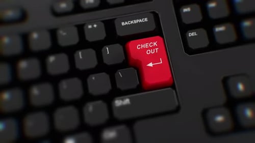 Rote Checkout-Taste auf der Tastatur. Ein Finger drückt Auschecken. Klicken Sie auf Auschecken. Realistische Tastatur
