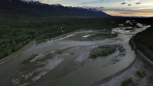Drone View of Sunset Sky with Snowcapped Mountains and River 2 Above
