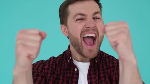 Excited Man Celebrates and Shouts in Victory