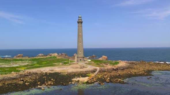 Phare De L le Vierge Lighthouse Towering Over Rocky Coastline In phare-de-l-le-vierge-lighthouse-towering-over-rocky-coastline-in