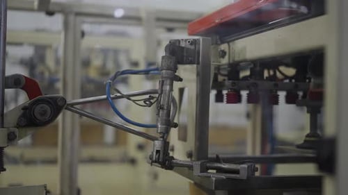 Packaging machine operating at canned food factory.