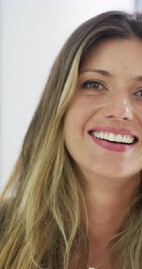 Woman, face and laugh at startup in office with confidence, joke and coworking for career