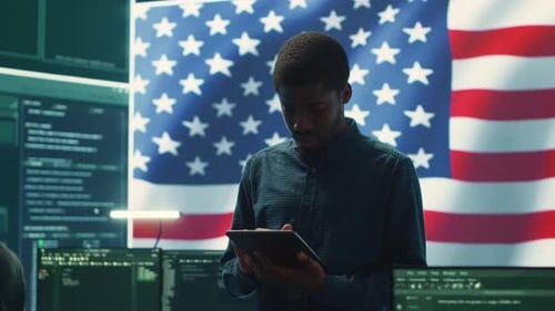 Man With Tablet and American Flag