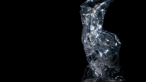 Crushed Plastic Bottle Close Up on Black