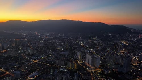 George Town city skyline at sunset with a beautiful orange sky