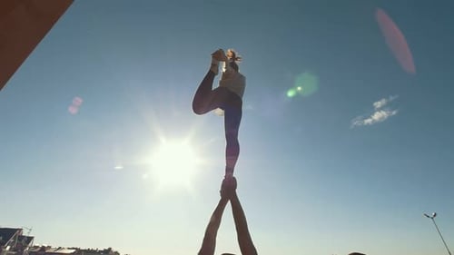 Couple Performing Front Plank Bird Pose Young Man Holding Flying