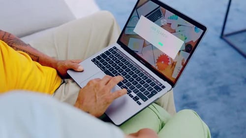 Job search, hands and laptop on a living room sofa doing web search for we are hiring post