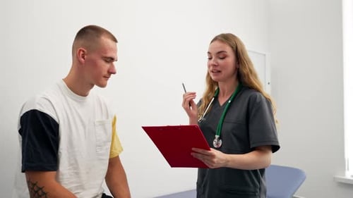 in a Modern Clinic in a Small Therapist s Office a Young Girl Doctor with a Stethoscope is Examining