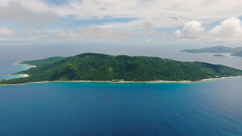 Green Island with Surrounding Bright Blue Waters La Digue Seychelles