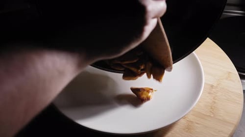 Freshly Cooked Chicken Breast From Pan To Plate. close up