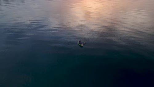 Fisherman in a Canoe on the Mediterranean Sea at Dawn