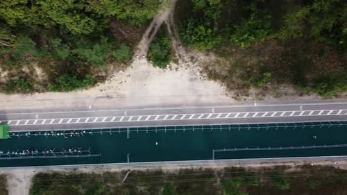People are Running on Triathlon and Taking Bikes From Special Parking Place Filmed From Above