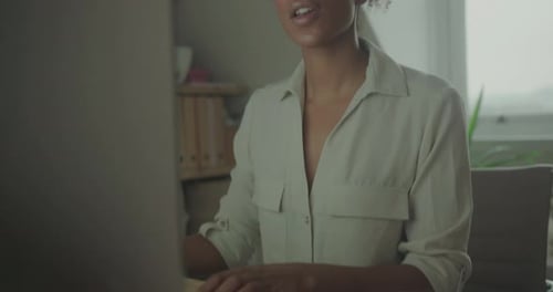 Woman Working on Computer at Home