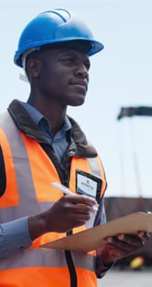 Construction site, clipboard or black man writing for inspection, safety protocol