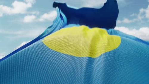 Realistic Palau Flag Waving in Wind with Blue Sky