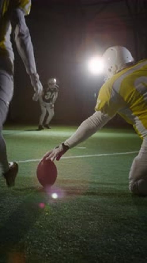 Gridiron Footballers Training to Perform Place Kick during Routine Practice