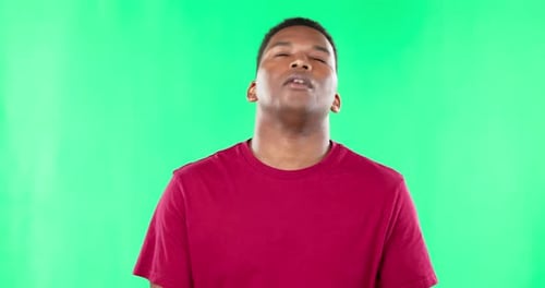 Phone, bad news and disappointment with a frustrated black man in studio on a green screen