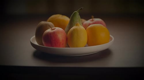 Fresh Fruits Arranged on a White Plate
