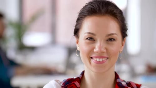 Smiling Young Woman Close-Up Portrait in Office Setting
