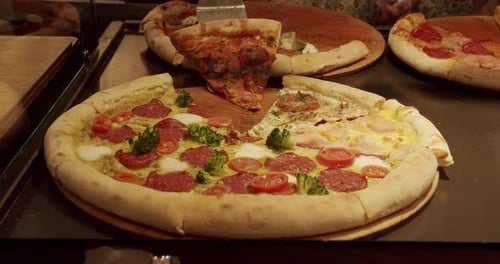 Lots of Pizza Slice on the Table in a Pizzeria Delicious Pizza