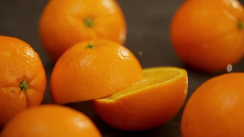 A Whole Orange Falls on the Table and Spectacularly Splits in Half