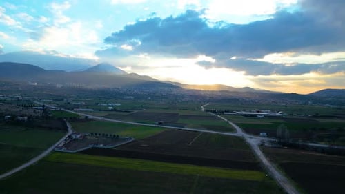Aerial View of Green Fields at Sunset