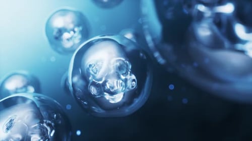Abstract Microscopic Cells Dividing and Glowing in Fluid