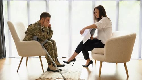 Man in Military Uniform Receives Counseling