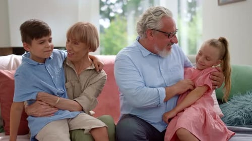 Grandparents With Grandchildren Enjoying Time Together at Home