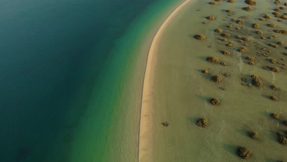 Sand bank splits tropical turquoise deep ocean shallow water mangrove ...