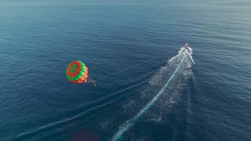 Aerial View Chasing the Sun Parasailing at Day's End