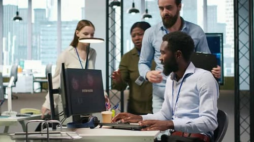 Programmer in Office Requesting Help From Coworkers to Fix Critical Error