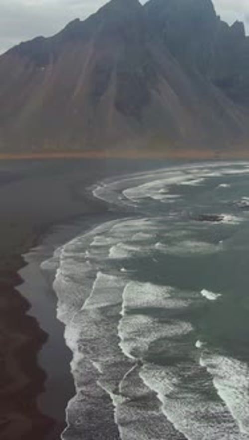 Vestrahorn Mountain and Sea Coast Iceland Aerial View Vertical Video