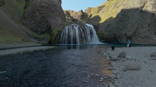Aerial View Of Waterfall And Volcanic Glacier In The Mountains Of Iceland
